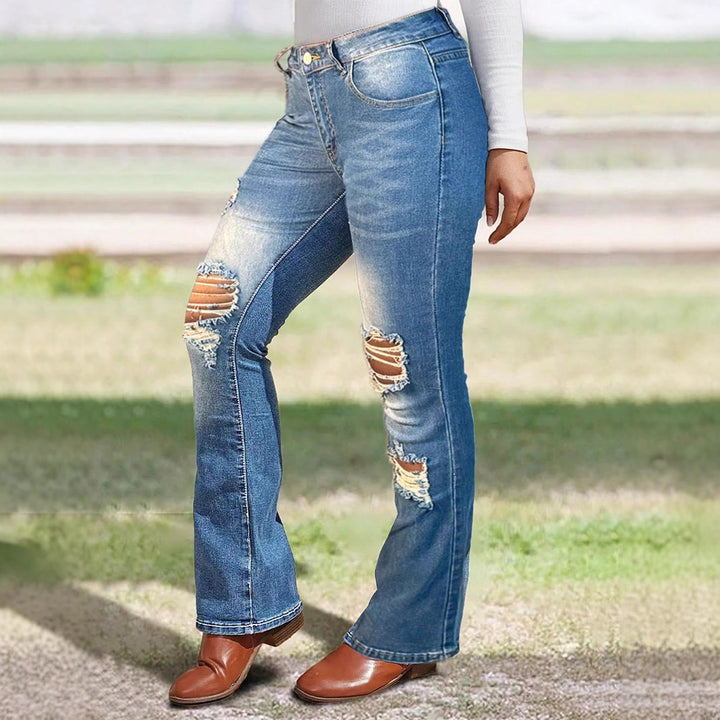 Women's waist-accentuated stretch denim jeans with flared leg and prominent knee rips Amarae