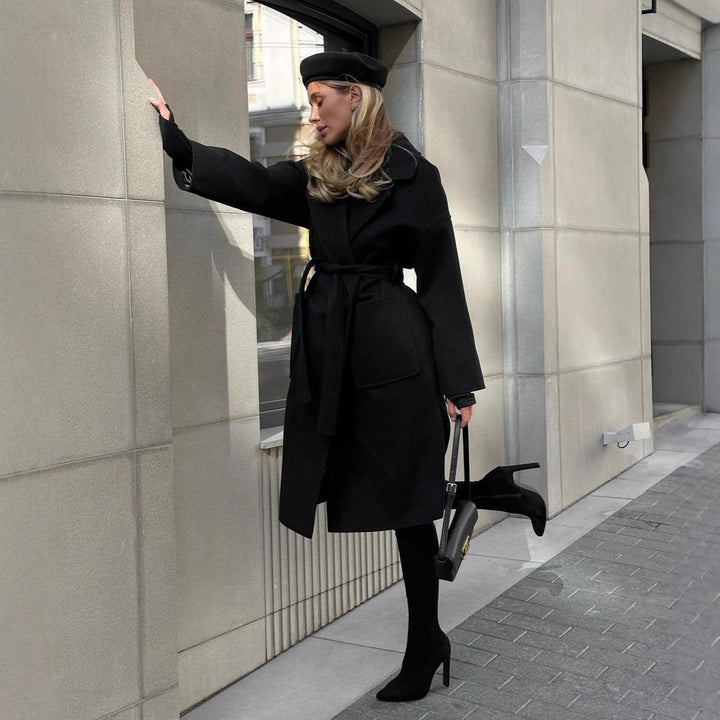 Elegant transitional coat for women with wide lapels and belt detail Lune London