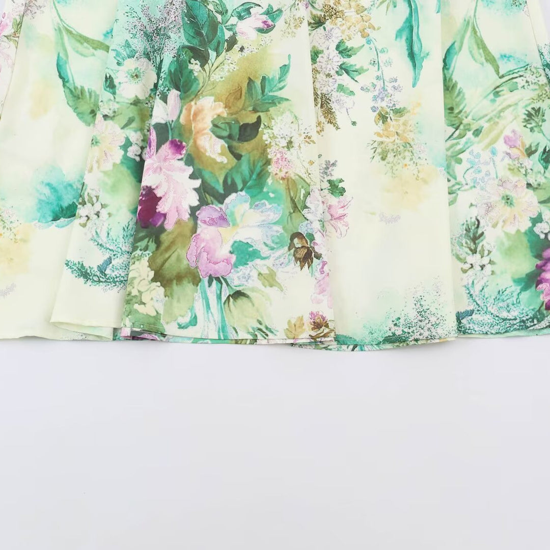 Women’s midi dress with pleated bodice, bell sleeves, and floral A-line skirt