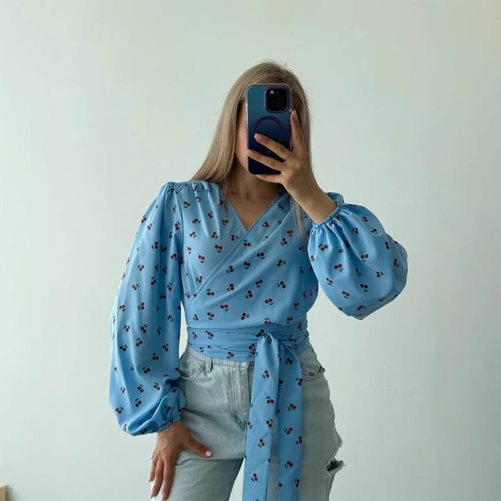 Women's wrap blouse with cherry print, wide puff sleeves & tie belt Amarae