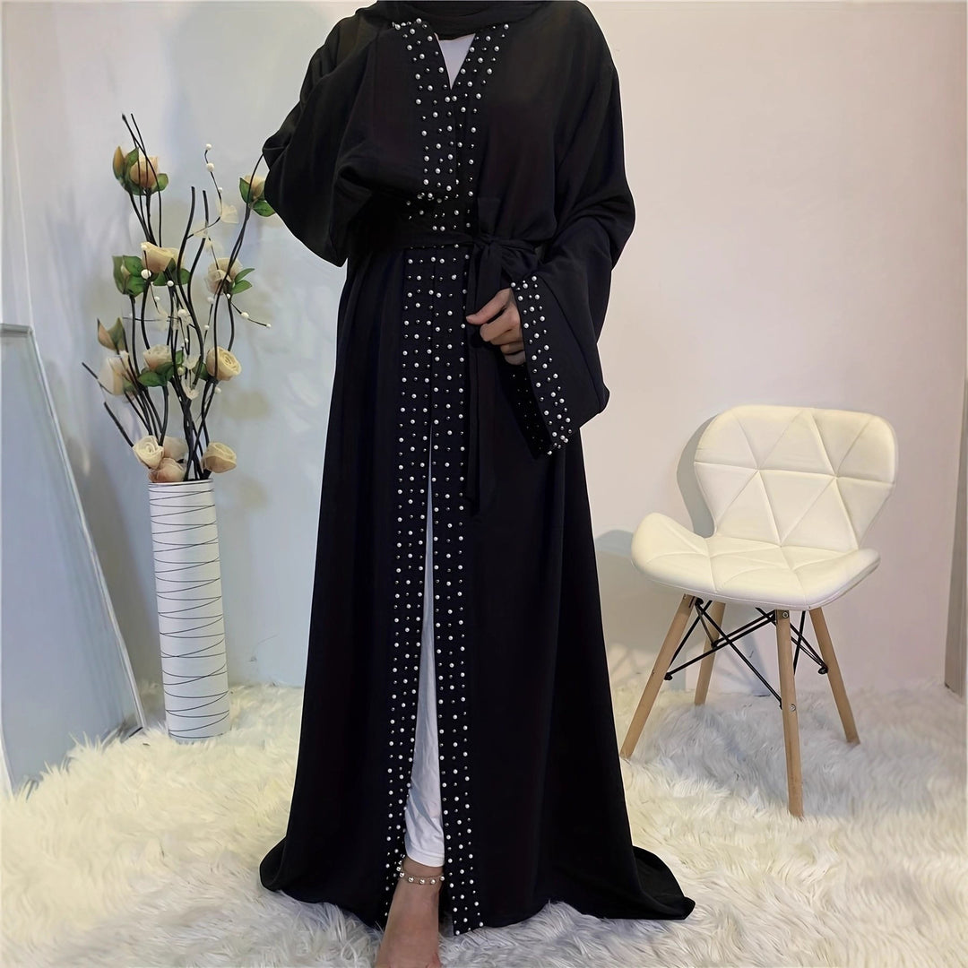 Elegant ladies Abaya with elaborate rhinestone details and a chic waist belt