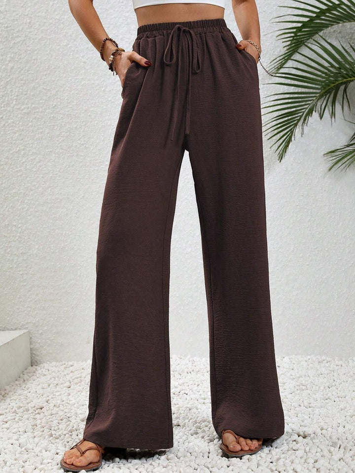 Pantalons larges d'été pour femmes avec taille élastique et poches latérales pratiques Chic & Stil