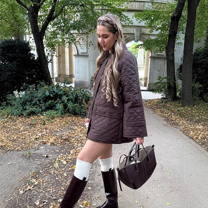 Women's oversized quilted jacket in coat style with snap button placket and patch flap pockets Amarae