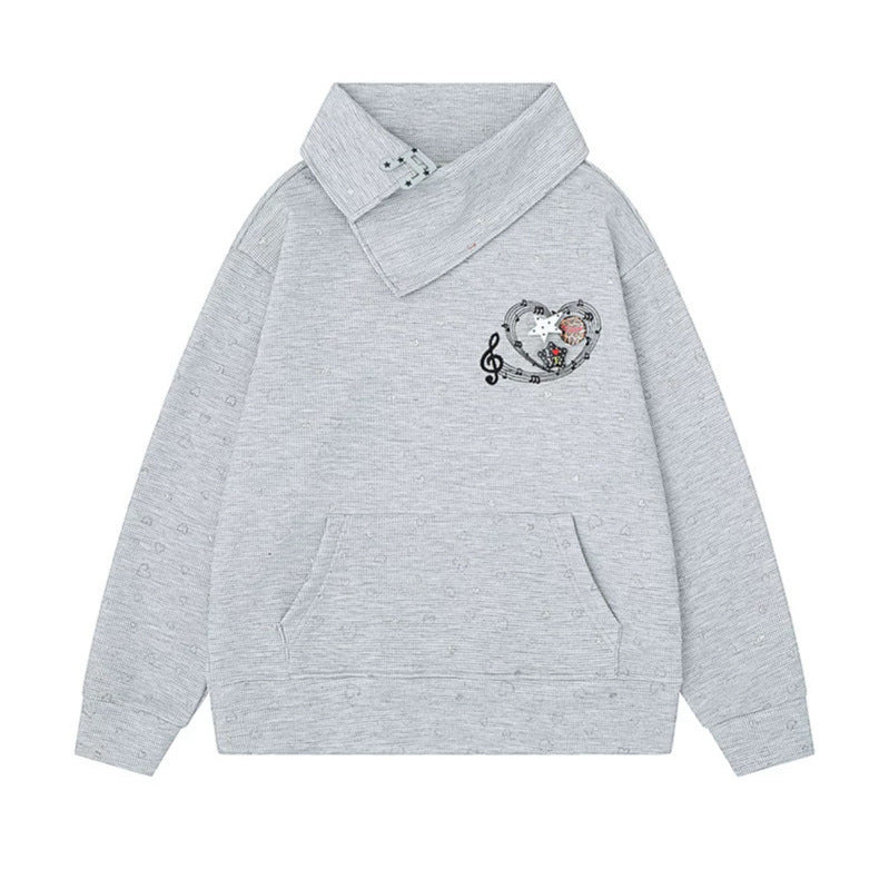 Women’s oversized sweatshirt with asymmetrical stand-up collar, kangaroo pocket and musical heart embroidery Amarae