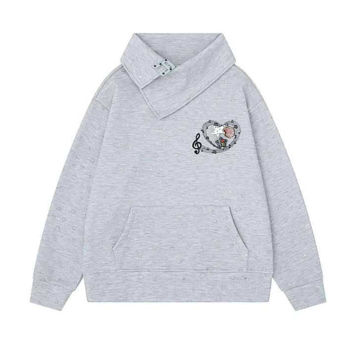 Women’s oversized sweatshirt with asymmetrical stand-up collar, kangaroo pocket and musical heart embroidery Amarae