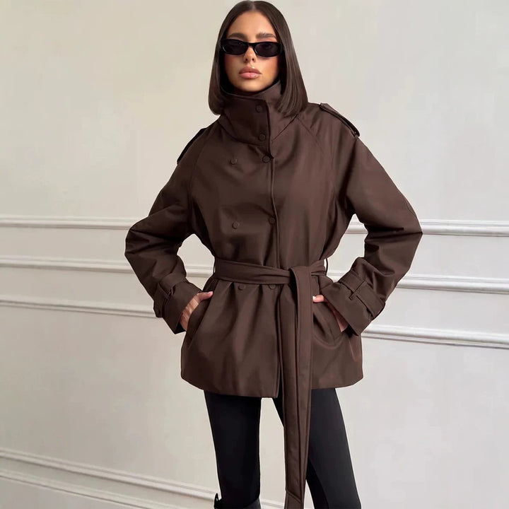 Women Short Technical Trench with High Collar Flap, Double Press Button Placket and Tailoring Tie Belt Amarae