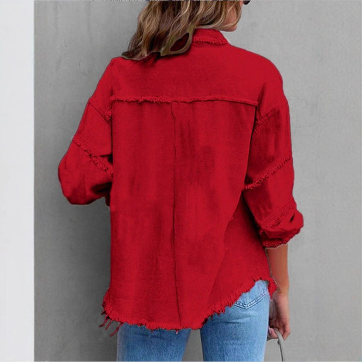 Women's oversized denim shirt jacket with fringe trim, flap pockets, and snap front Amarae
