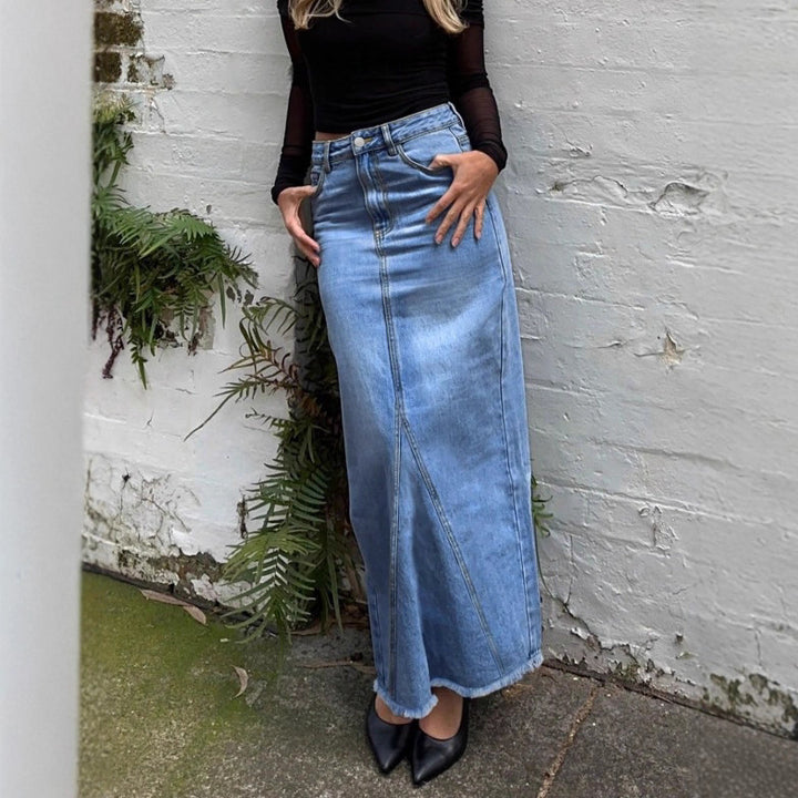 Ladies high-waisted denim maxi skirt with straight cut, decorative seams and raw fringe hem Amarae