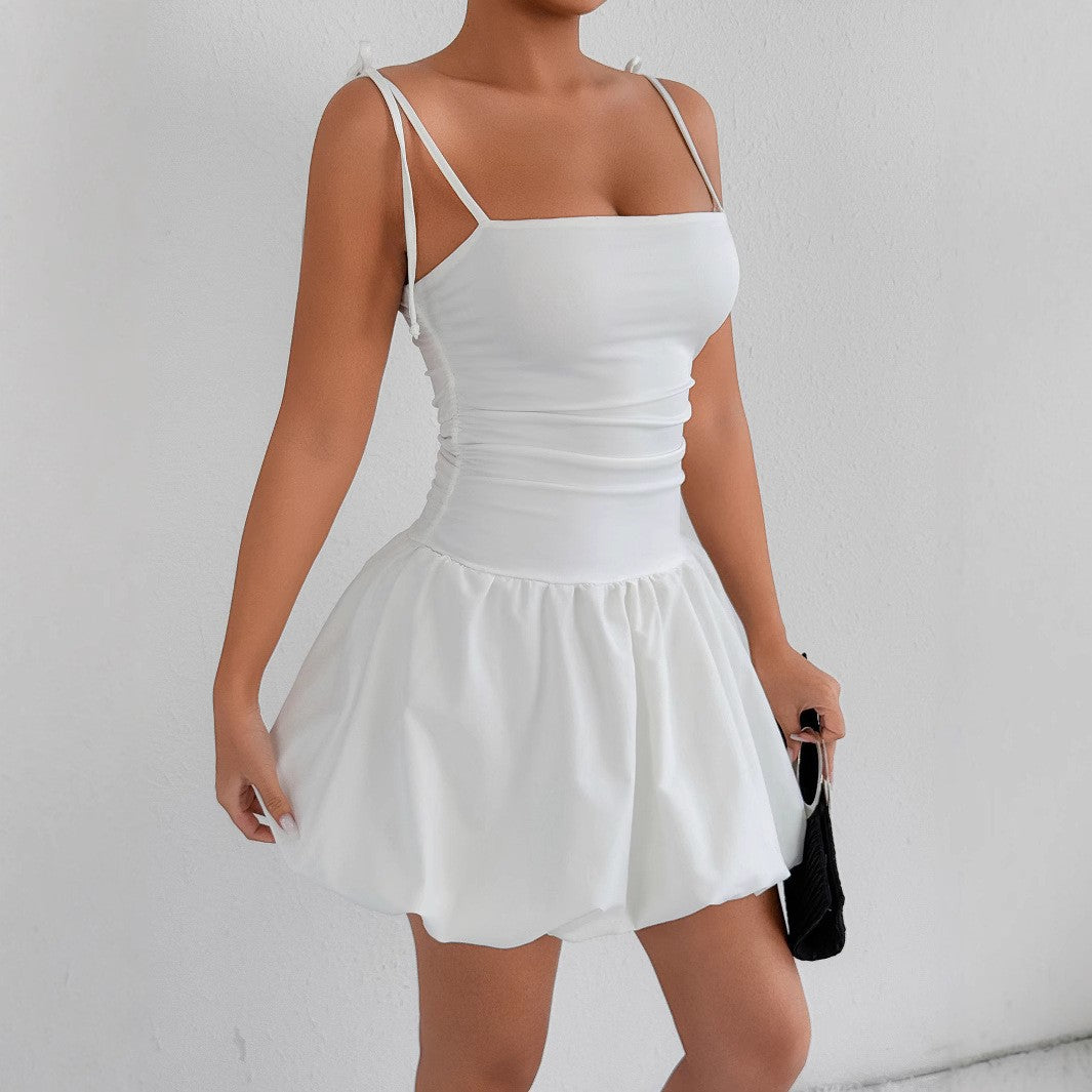 Women's playful mini dress with adjustable spaghetti straps and sophisticated ruffle hem Lune London