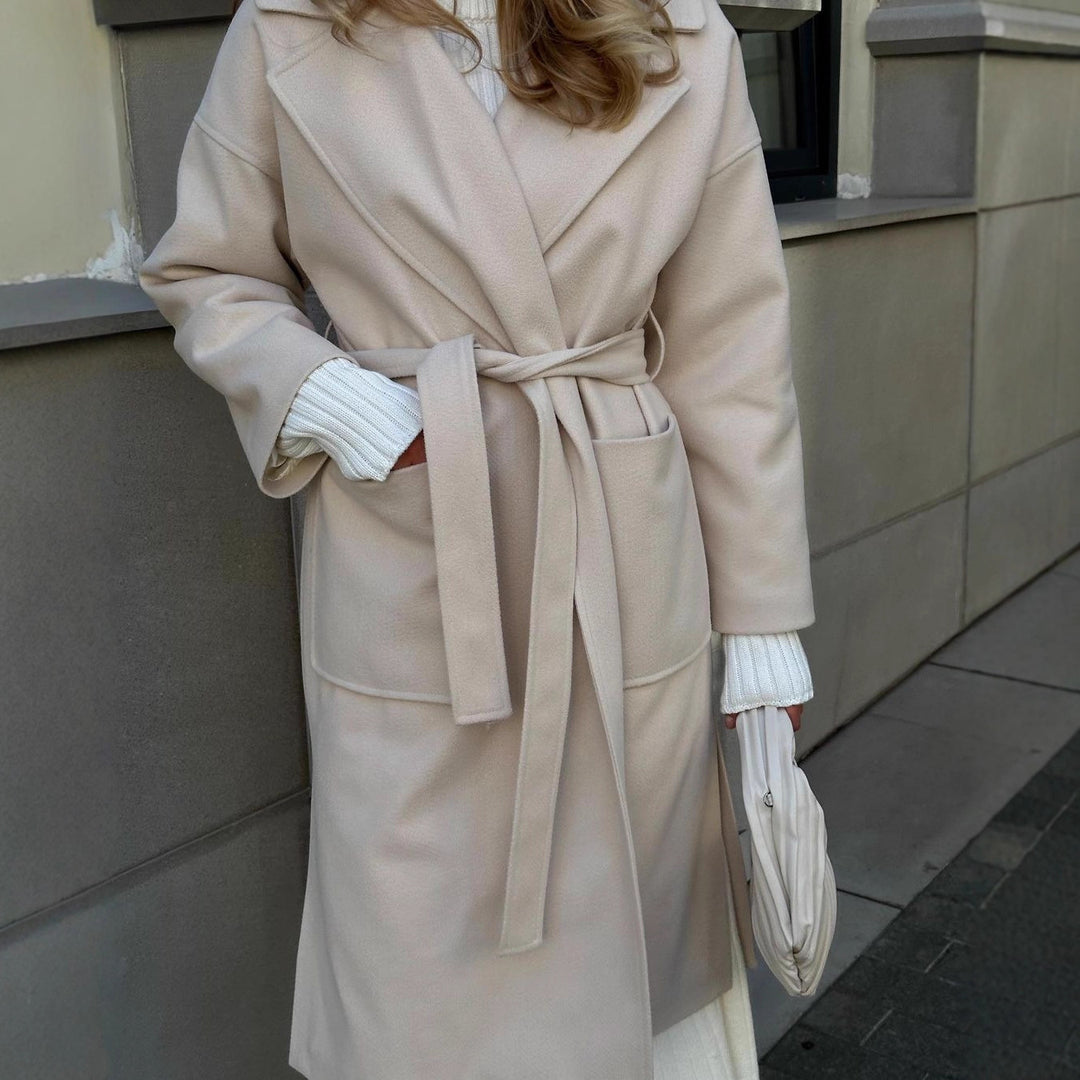 Elegant transitional coat for women with wide lapels and belt detail Lune London