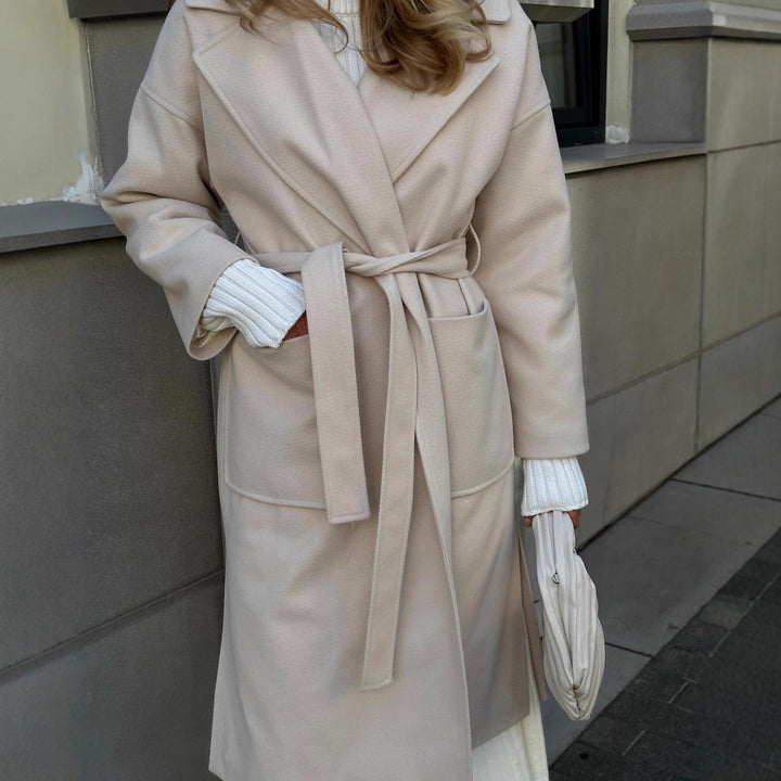 Elegant transitional coat for women with wide lapels and belt detail Lune London
