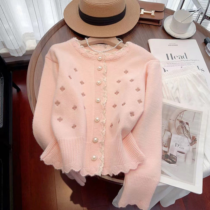 Knitted jacket for women with decorative pearl buttons and a delicate ribbed structure Lune London