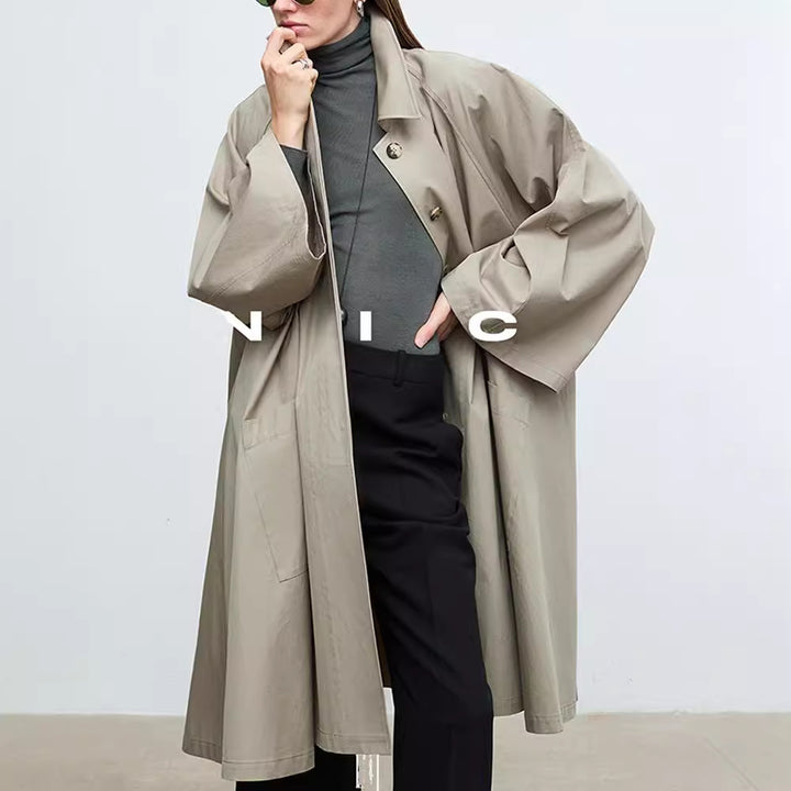 Manteau de trench décontracté pour femmes avec des manches surdimensionnées et des détails de boutons Chic & Stil