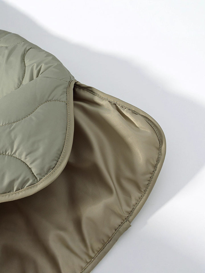 Quilted transition jacket for women with a soft fabric texture and practical snap buttons Lune London