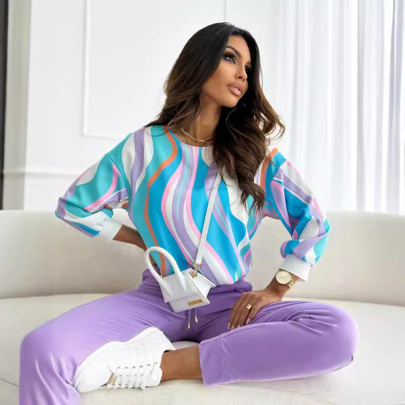 Casual women's sweatshirt with a colorful floral pattern and drop shoulders Lune London