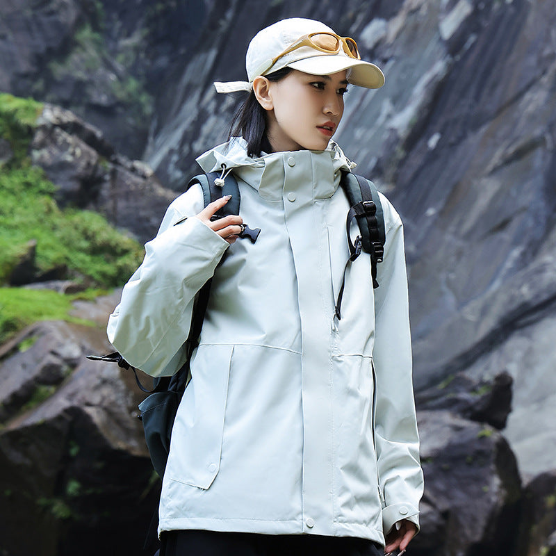 Women’s technical multi-layer hardshell rain jacket with adjustable hood, chest strap, and water-resistant zippers Amarae