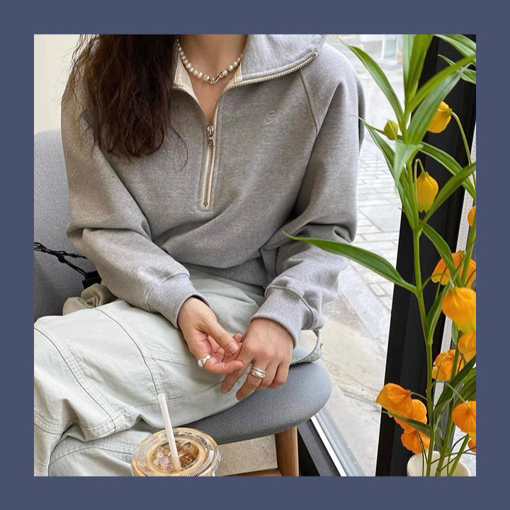 Pull à capuche stylé pour femme avec demi-zip Chic & Stil
