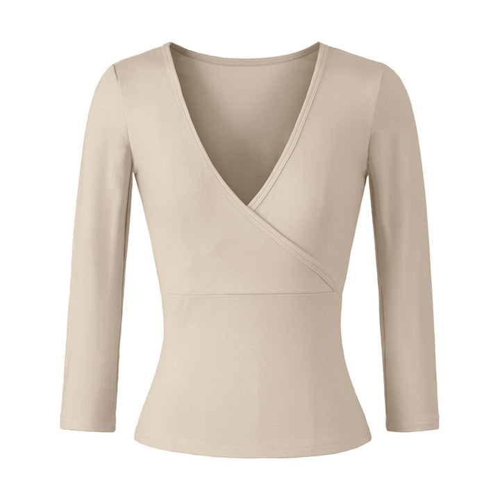 Women's figure-hugging wrap top made of stretch jersey with deep V-neck and tailored silhouette.