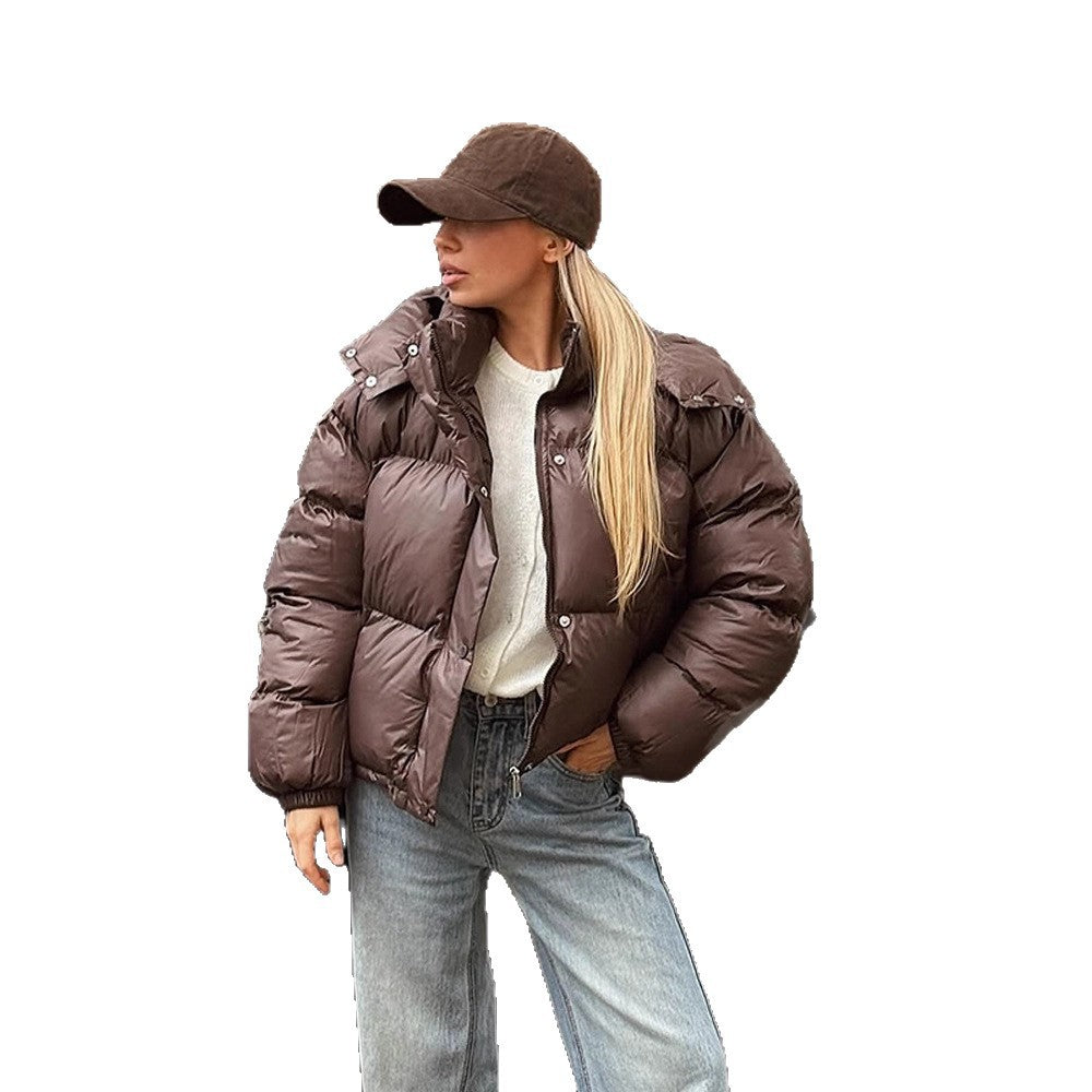 Women's short-cut shiny quilted jacket with high stand-up collar and snap-button placket Amarae