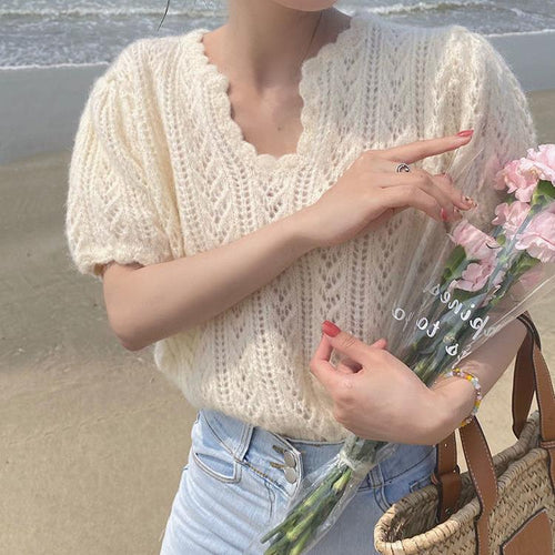 Knitted sweater for women with a feminine openwork pattern Amarae
