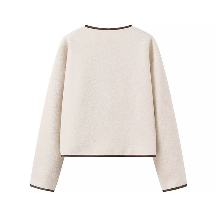 Fashion women's transitional jacket with decorative drawstring and side pockets.