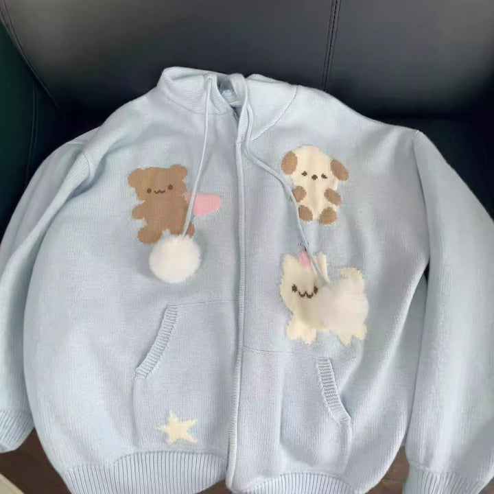 Hooded jacket for ladies with playful animal patterns and pom poms Lune London