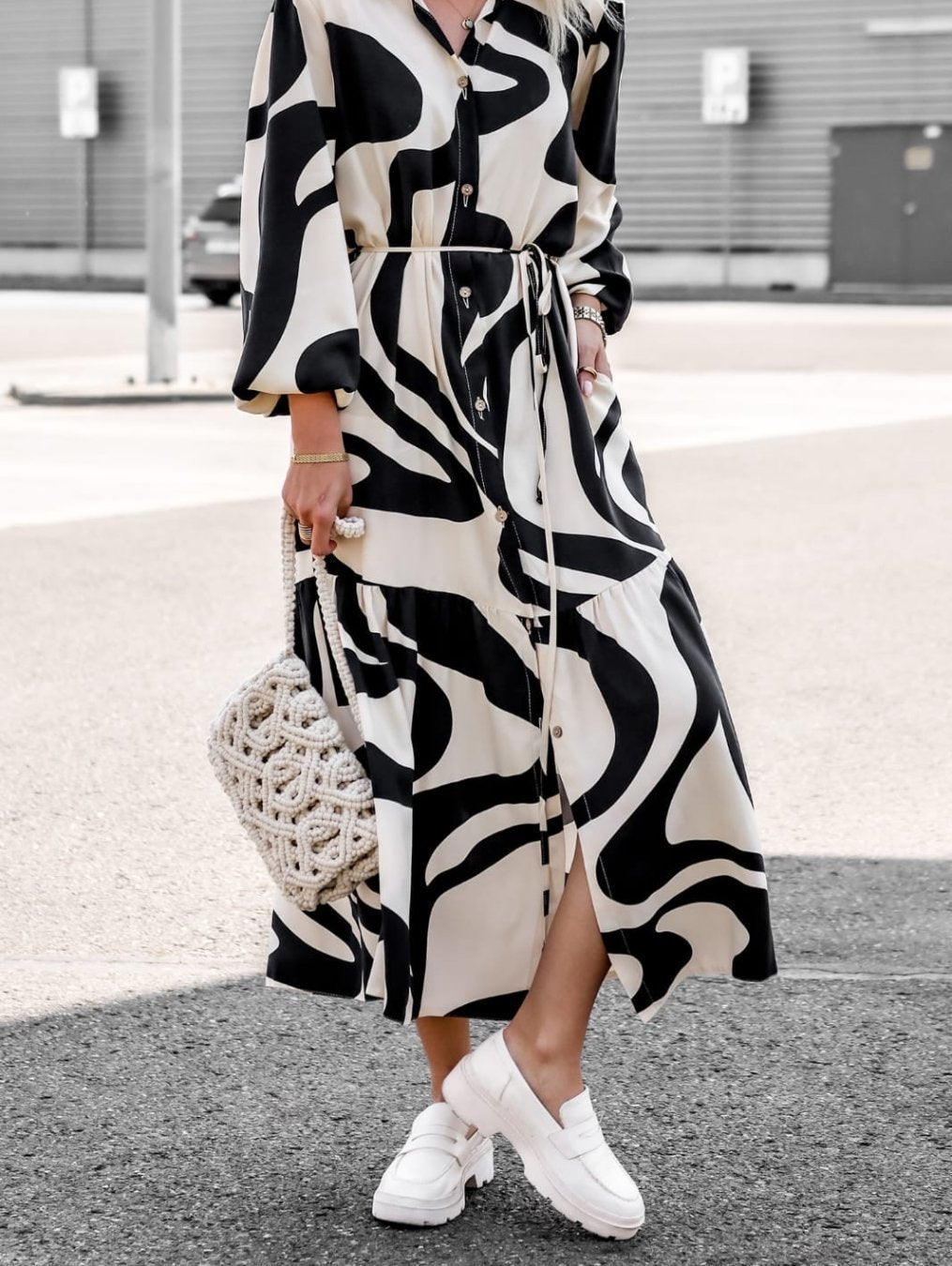 Long sleeve women's dress with trendy pattern and practical belt.