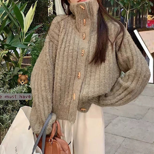 Cozy knitted sweater for women with a high collar and button details Amarae