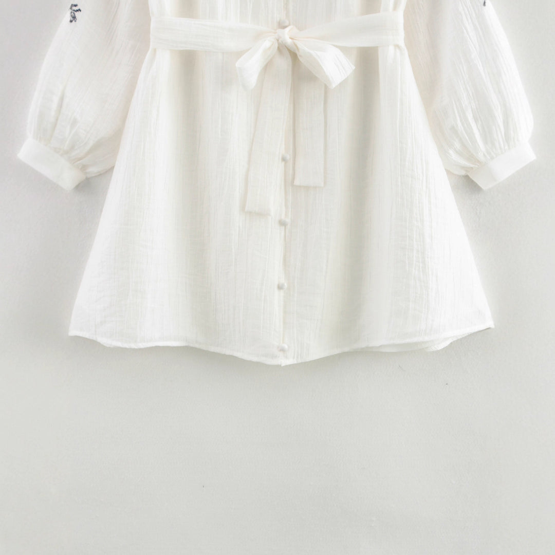 Elegant women's blouse with floral embroidery detail Lune London