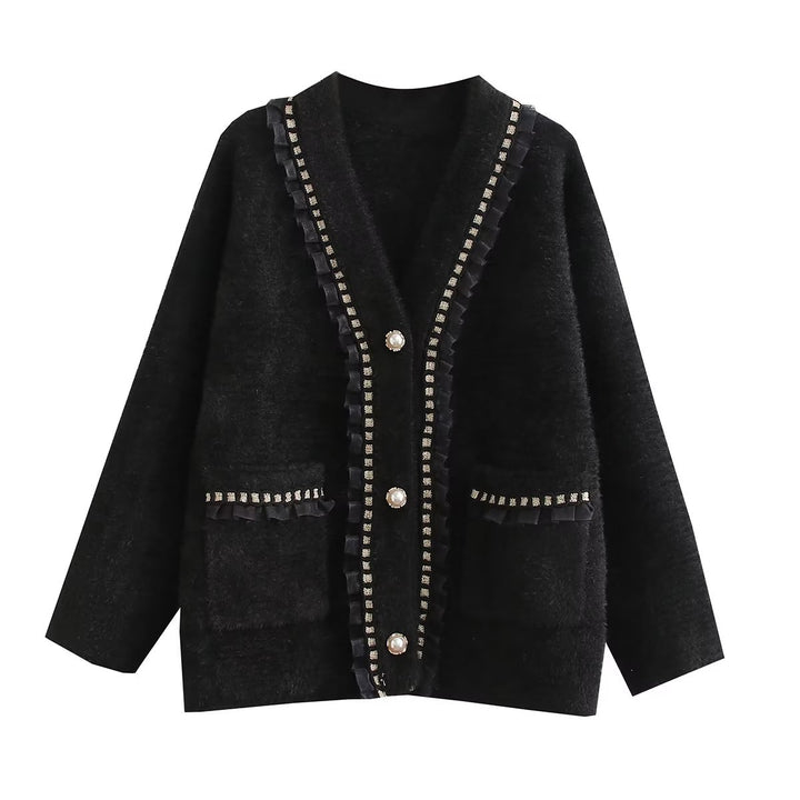 Fashionable women's knitted jacket with decorative ruffles and button details adorned with pearls Lune London