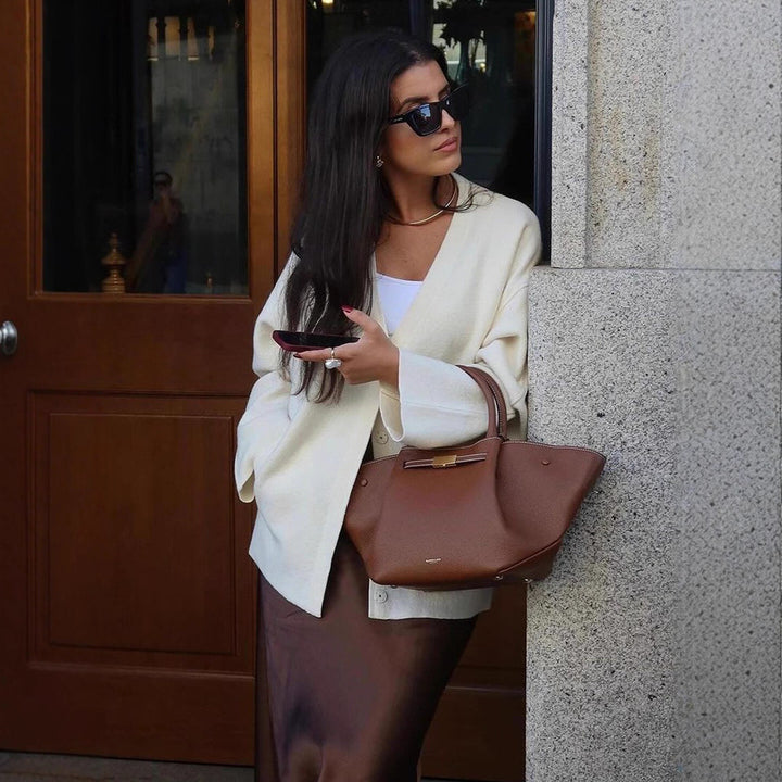 Women's chunky knit cardigan with deep V-neckline, boxy oversized silhouette and patch pockets Amarae