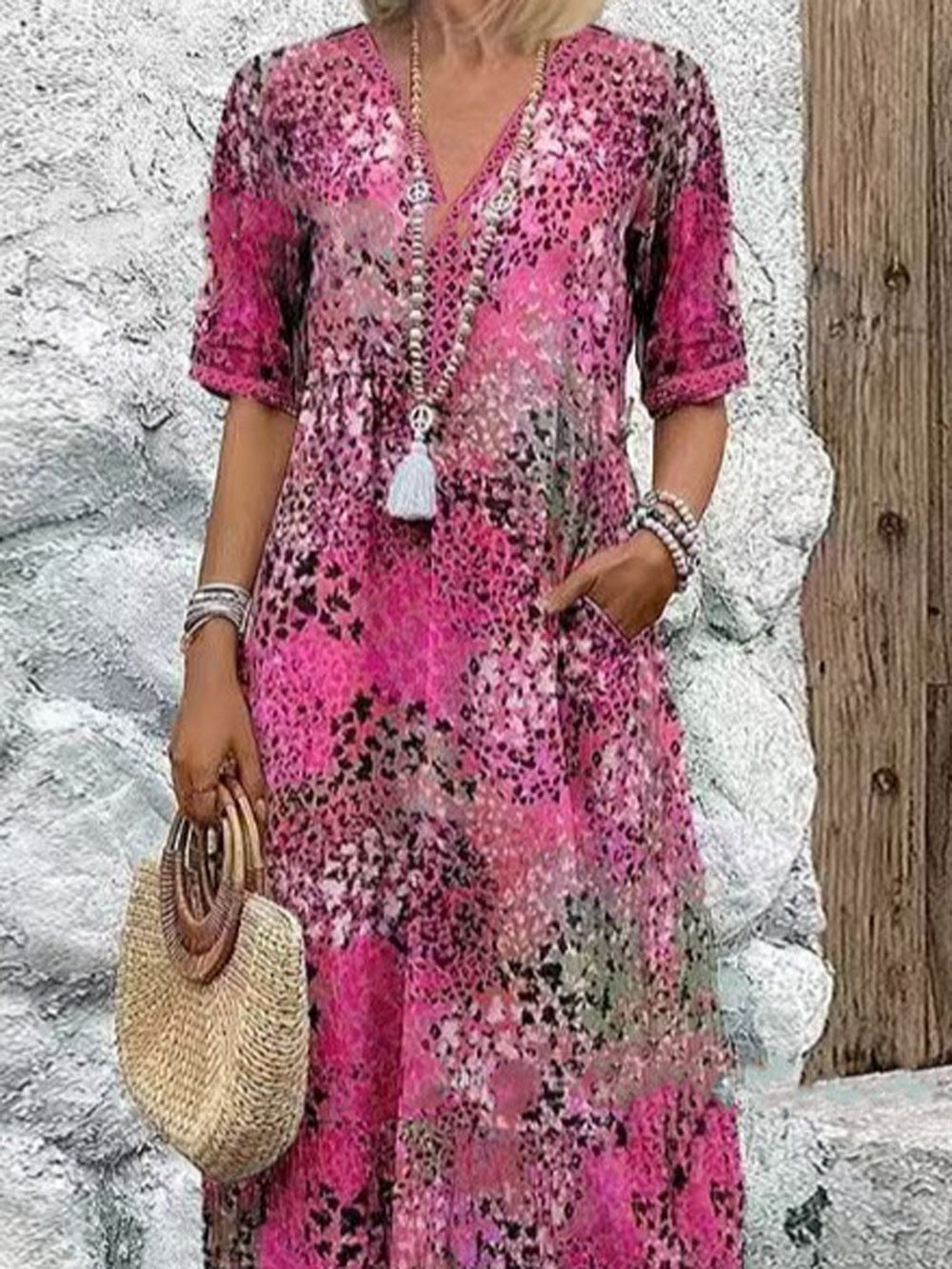 Maxi dress for women with V-neckline and practical side pockets Lune London