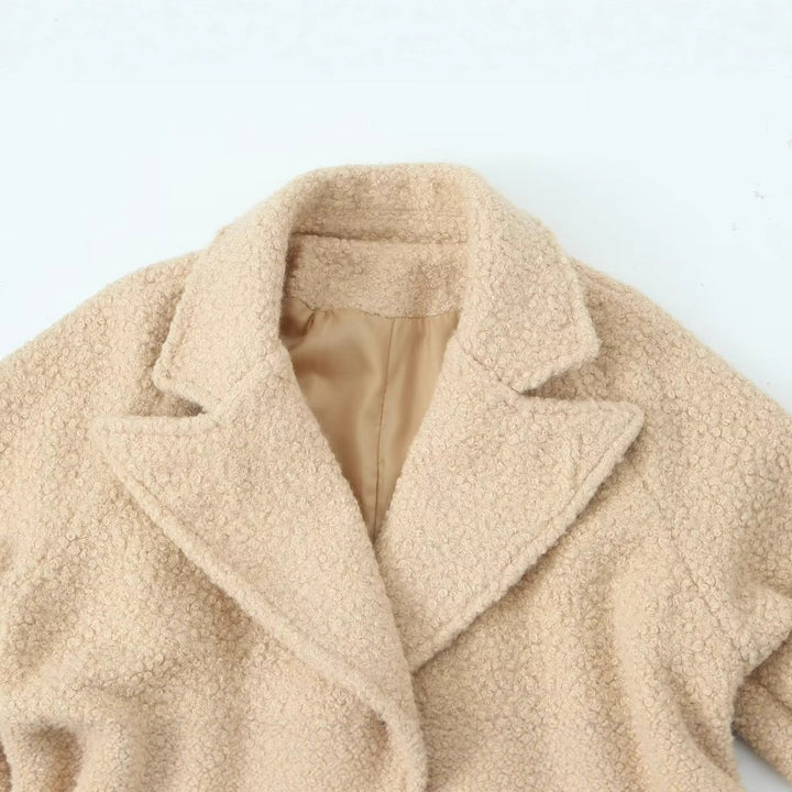 Women Long Teddy Coat in Trench Style with Double-Breasted Button Placket, Tied Belt, and Adjustable Cuffs Amarae