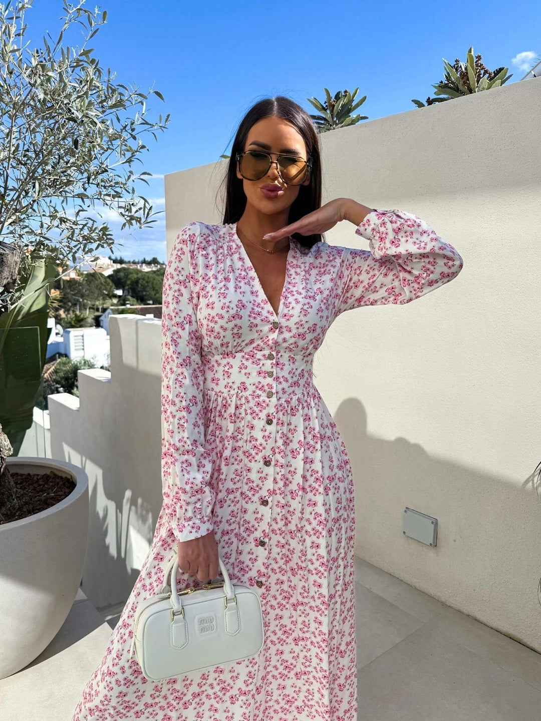 Elegant maxi dresses for women with floral patterns and button details Lune London