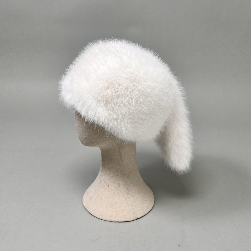 Women’s plush faux fur trapper hat with earflaps and decorative tail Amarae