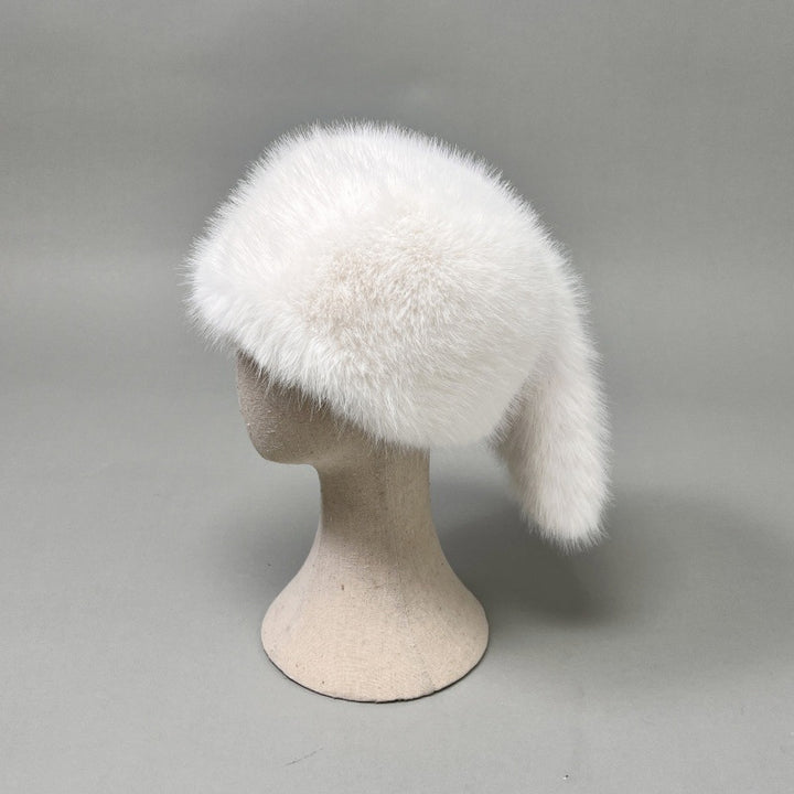 Women’s plush faux fur trapper hat with earflaps and decorative tail Amarae
