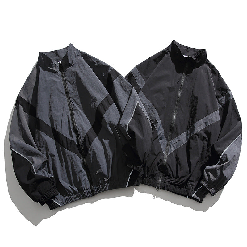 [Unisex] Oversize technical wind and rain jacket with stand-up collar, reflective piping, and elastic hem Amarae