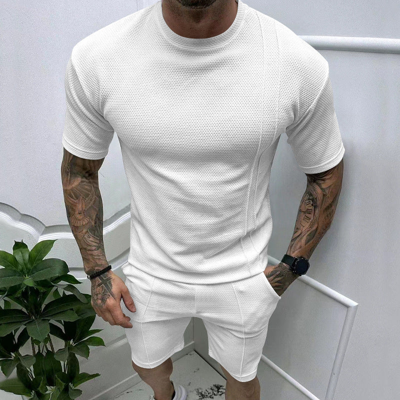 Men's short sleeve sports set with an innovative textured design and practical side pockets Lune London
