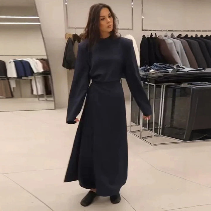 Women’s maxi dress with tailored silhouette, flared skirt and striking shoulders Amarae