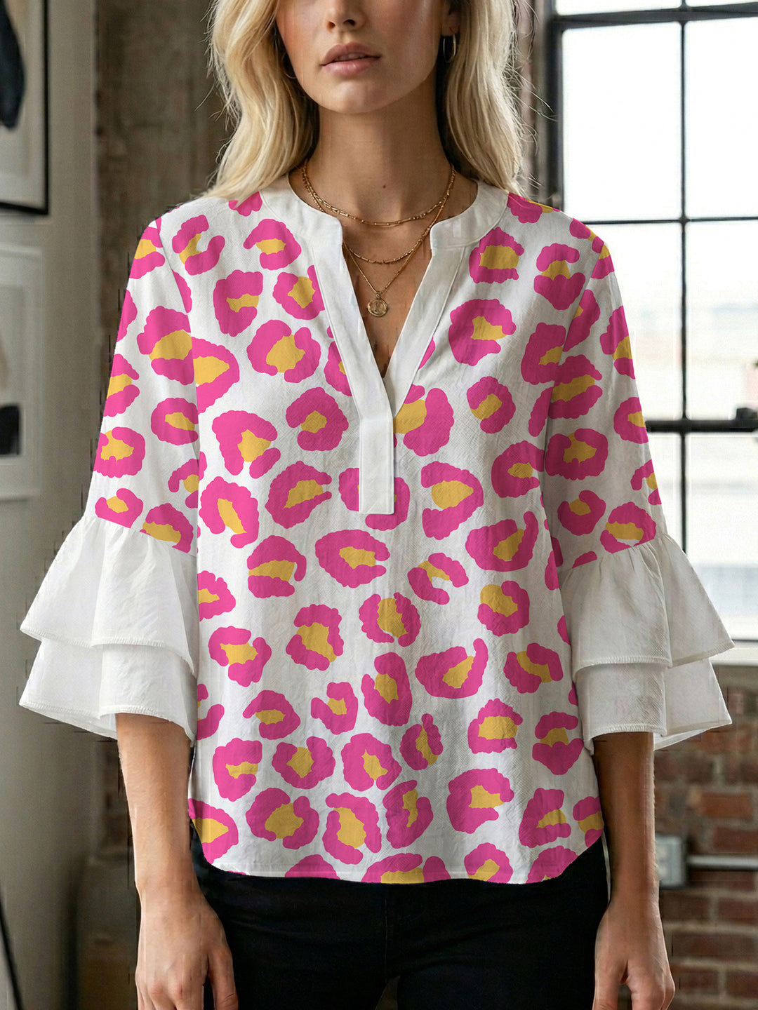 Women's blouse with ruffle details and eye-catching animal print Lune London