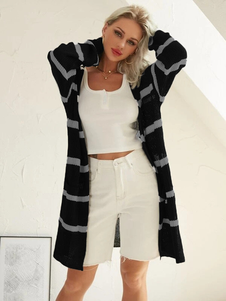 Knitted coat for women with a trendy layered look featuring a chic striped design