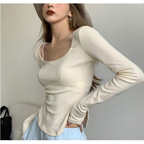 Women's long-sleeved top with elegant neckline and asymmetric design