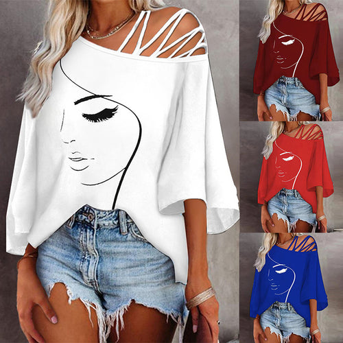 Women's tunic with asymmetric strap design and stylized face graphic Amarae