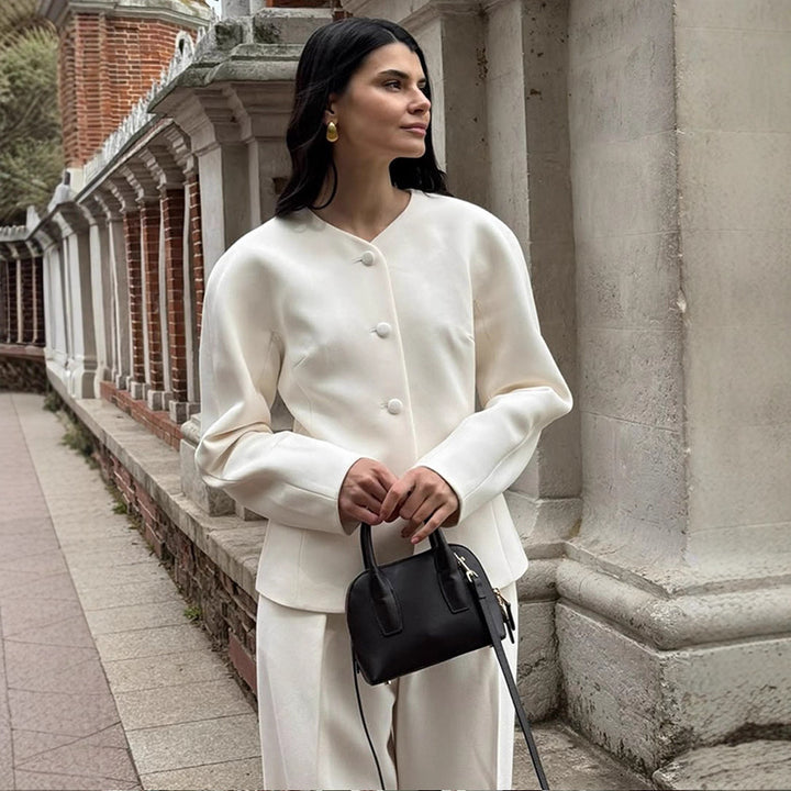 Women Short Blazer with Sculptural Shoulder, Rounded Neckline and Concealed Button Placket Amarae