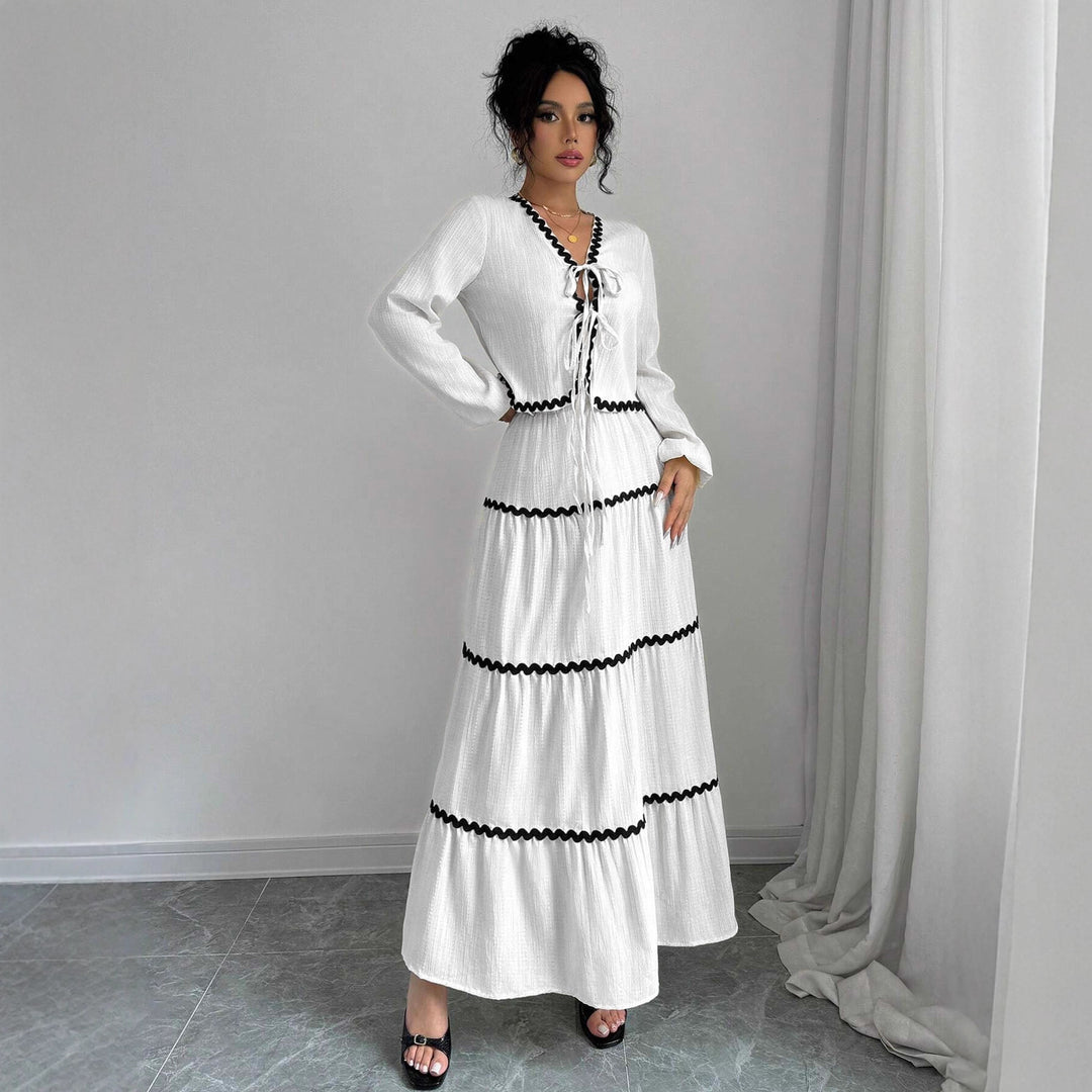Maxi dress for women with playful lace-up neckline and elegant ruffled skirt Lune London