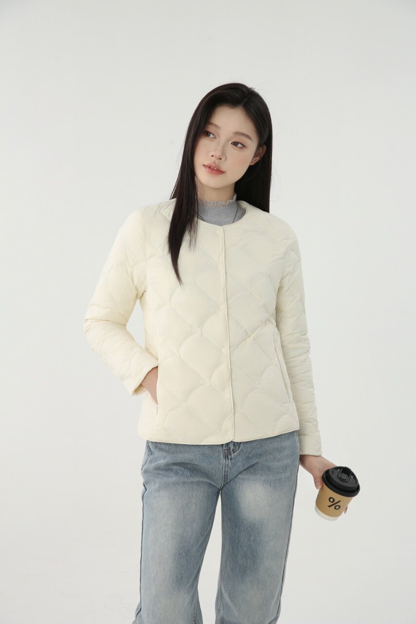 Women's light quilted short jacket with round neckline and shell stitching Amarae
