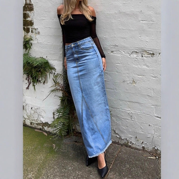 Ladies high-waisted denim maxi skirt with straight cut, decorative seams and raw fringe hem Amarae