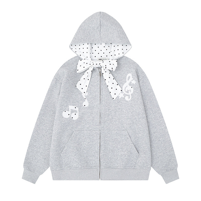 Women's hooded sweat jacket with polka dot hood lining, decorative bow, and music notes motif Amarae