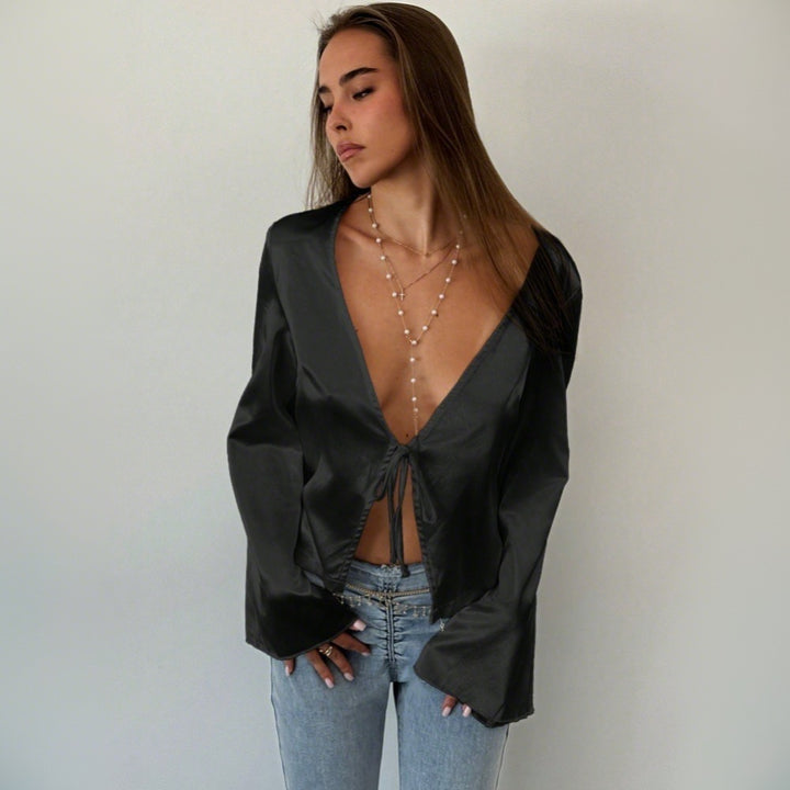 Blouse élégante femme avec décolleté en V profond et détail de nœud décontracté Chic & Stil