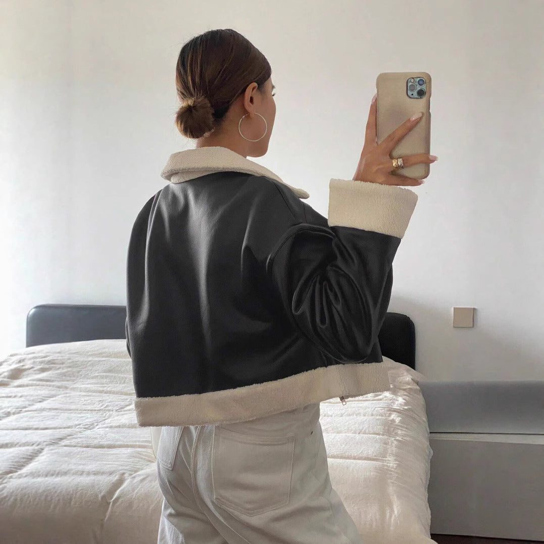 Faux leather jacket for women in modern biker style with fur collar and short sleeves Lune London